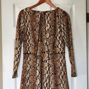 Michael Kors leopard pattern A-line dress with accent piping and rear zipper.